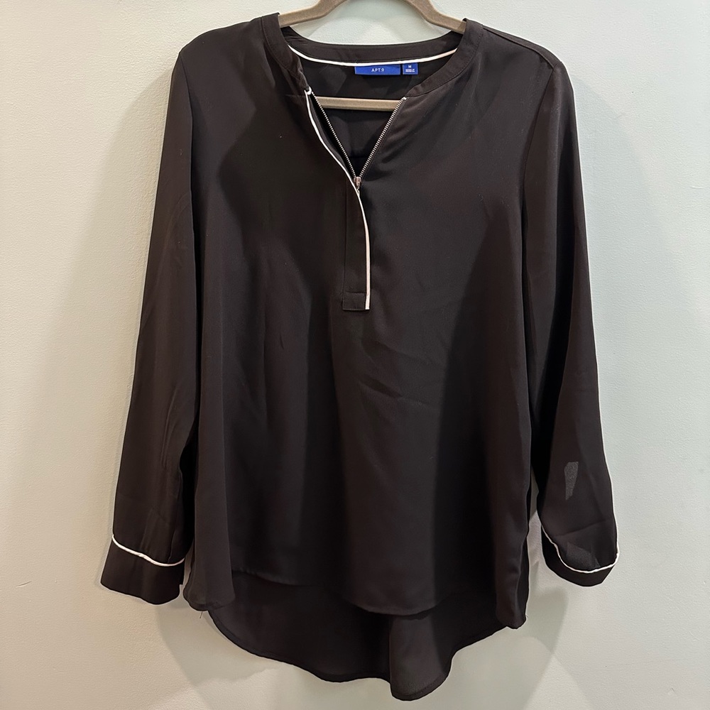Zip front black blouse with white accents. Cute for office!